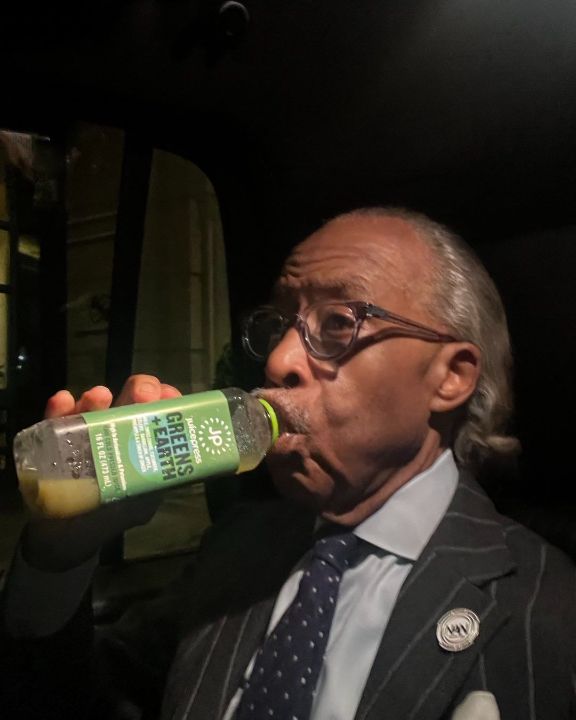AI Sharpton drinking Greens Earth juice. weightandskin.com